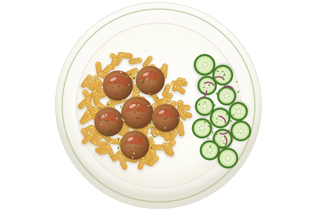 Chicken meatballs with rotini pasta and cucumber salad on a white plate