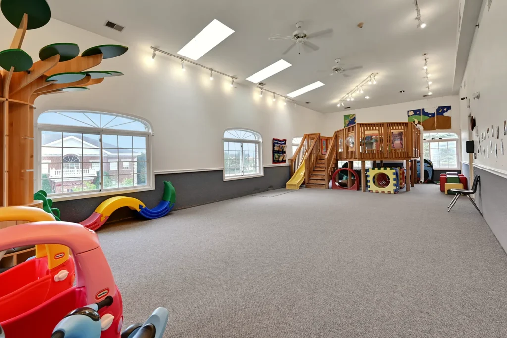 Large indoor gym for active play at The Learning Tree Center